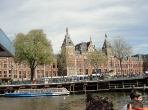 Centraal Station in Amsterdam with a tour boat