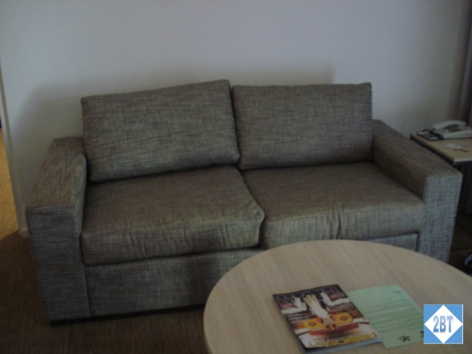 Second love seat in the living area. Behind that wall is the master bedroom.