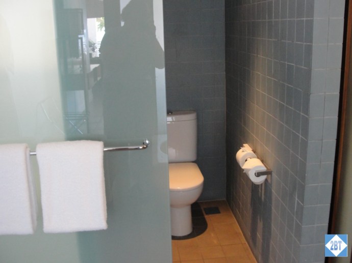 Toilet in master bath. Sliding door covers either the toilet or the shower but not both at the same time!