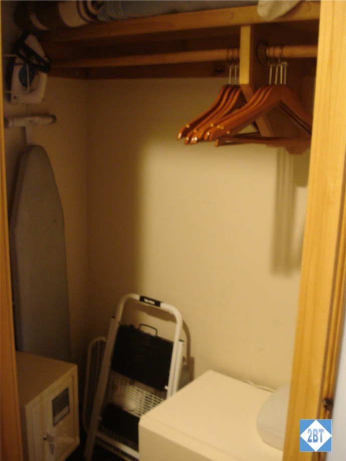 Left side of the hall closet