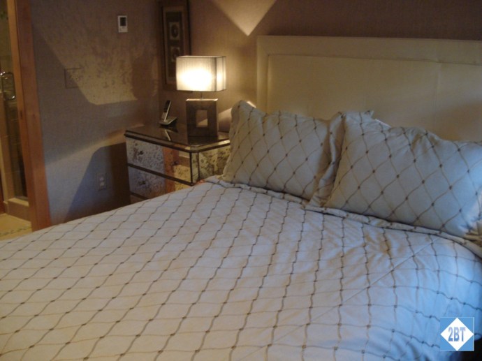 Queen bed and one of the night stands